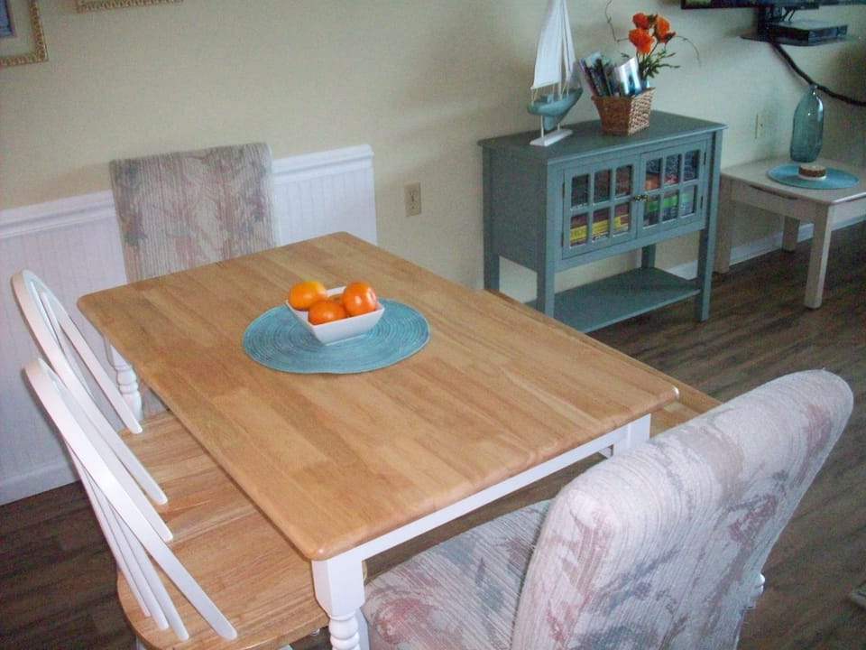 Dining Table, Chairs and Bench. Cabinet stocked with Board Games.
