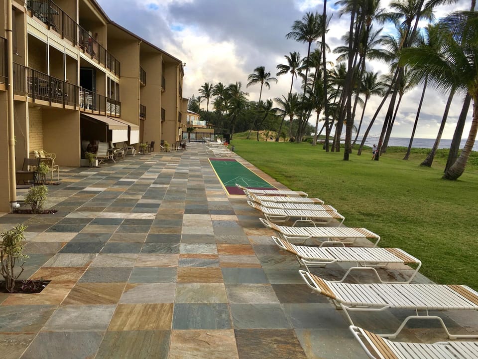 Ground floor lanai replaced in 2016 with beautiful quartzite & new shuffleboard.