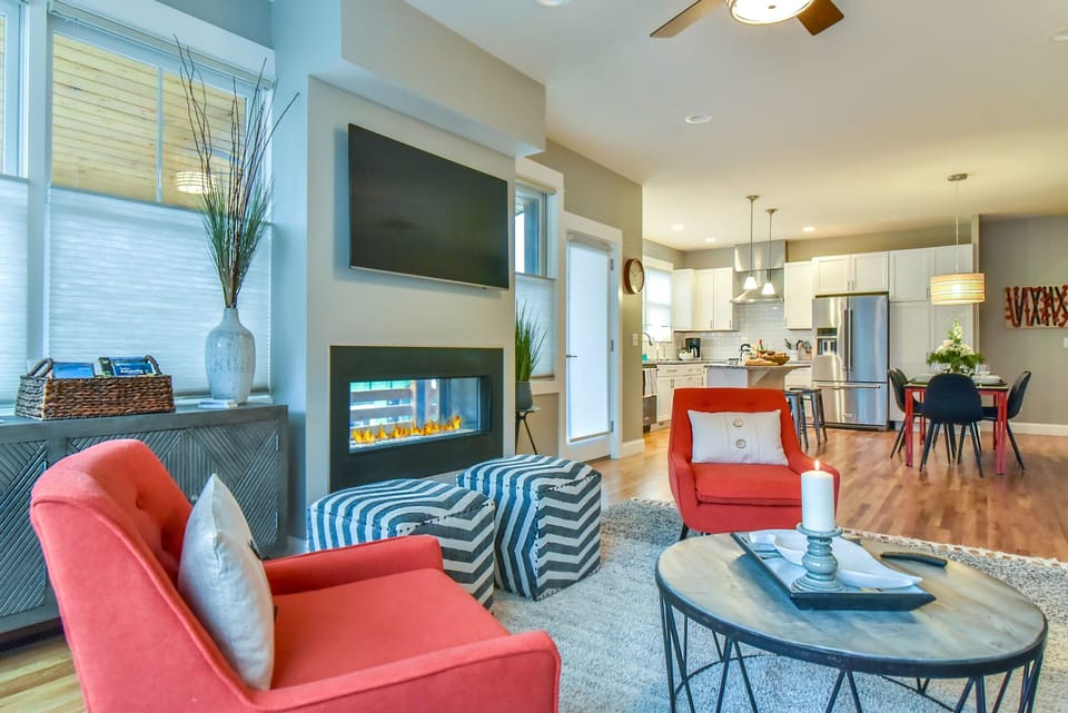 Cozy living area with modern fireplace, perfect for relaxation and entertaining.