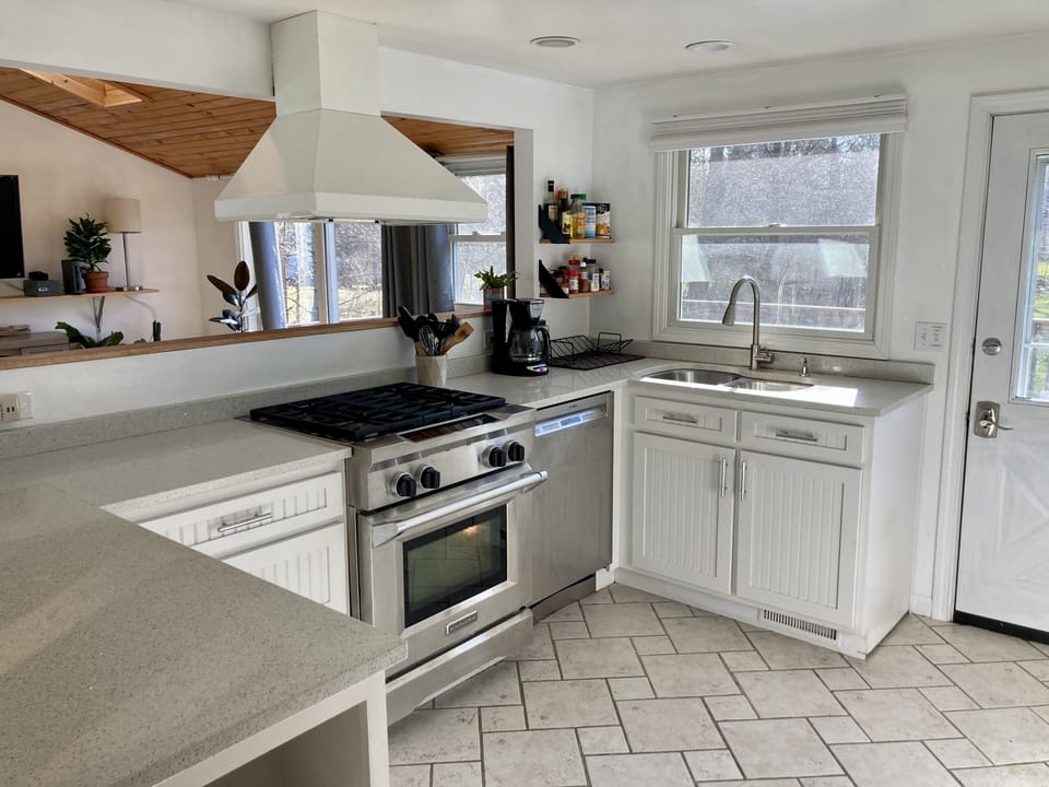 Well stocked Kitchen feat gas range, convection oven, DW, fridge, microwave 