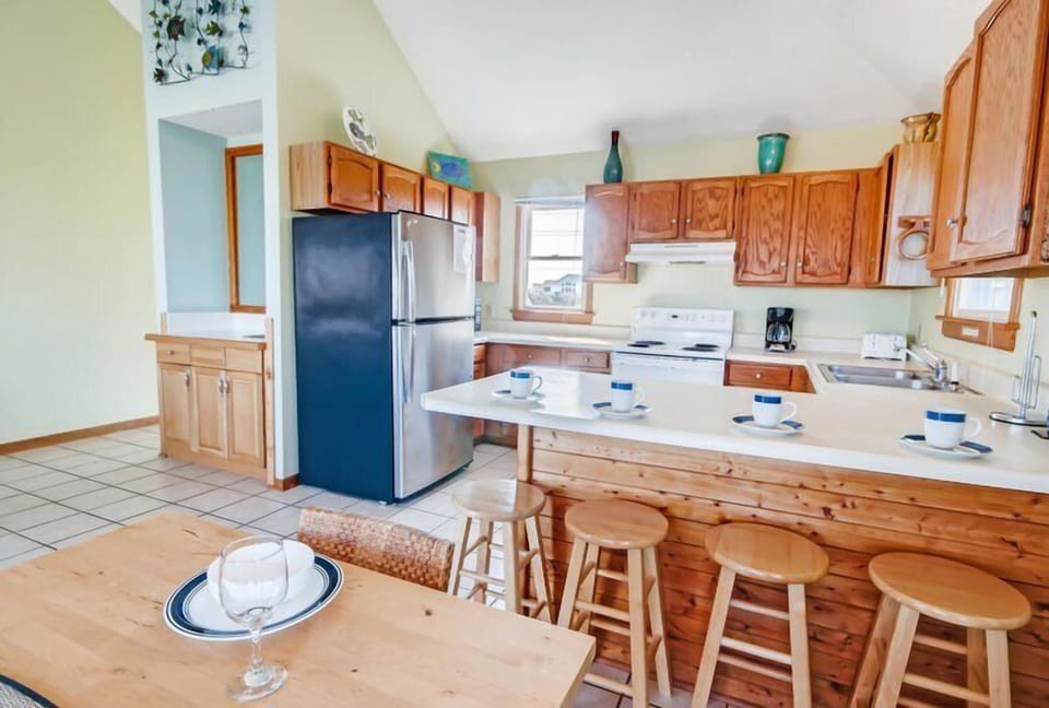 A quaint kitchen bathed in natural light, offering warmth and charm.