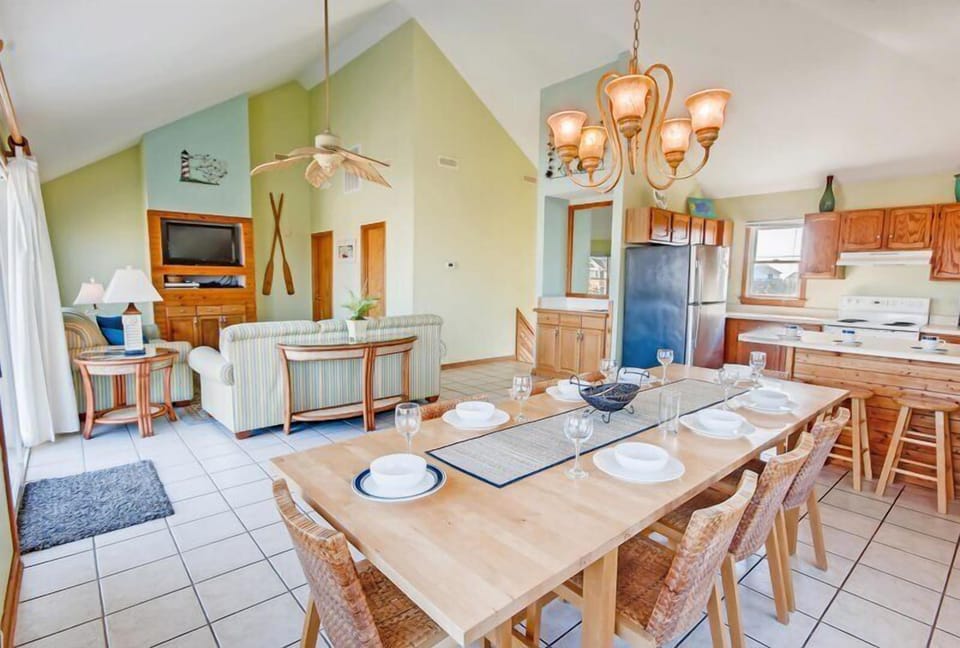 An elegant dining room seamlessly flowing into the great room, perfect for open-concept living and entertaining.