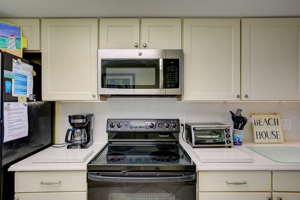 Modern appliances with toaster over as well as coffee pot AND Keurig 