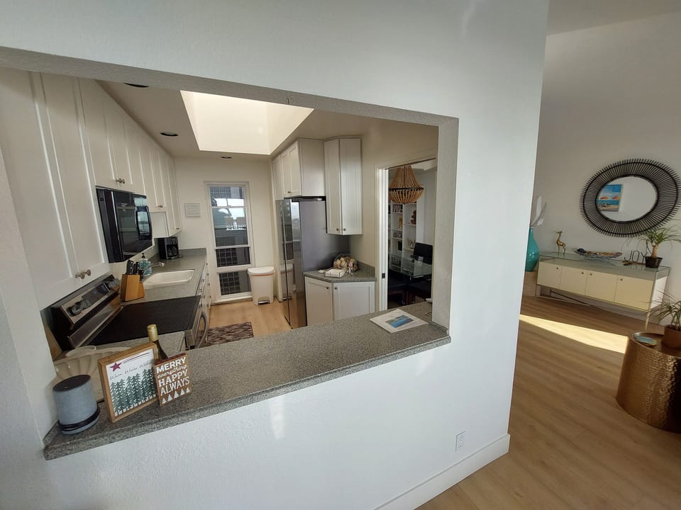 Kitchen open to dining and living areas.