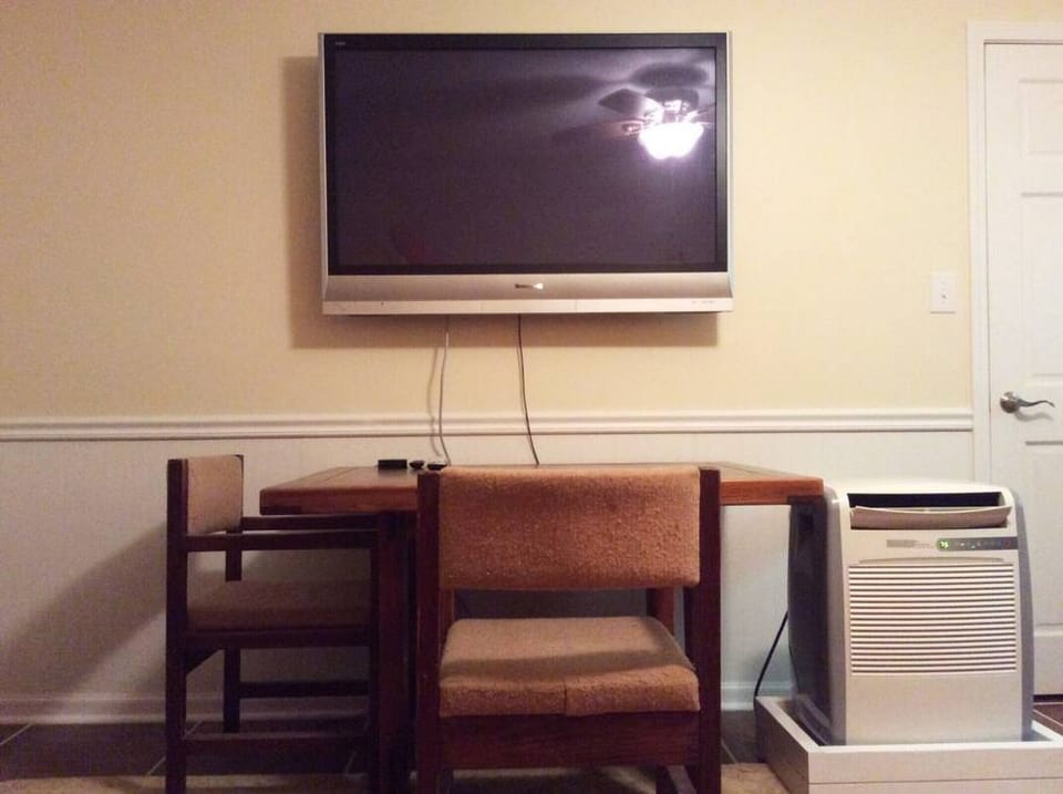 Bunk room with it`s own, big-screen TV and desk for games.