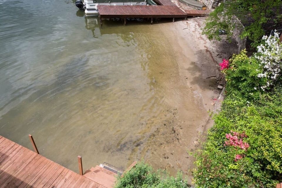 Few homes can claim such an enticing amenity as a beach and shallow water.