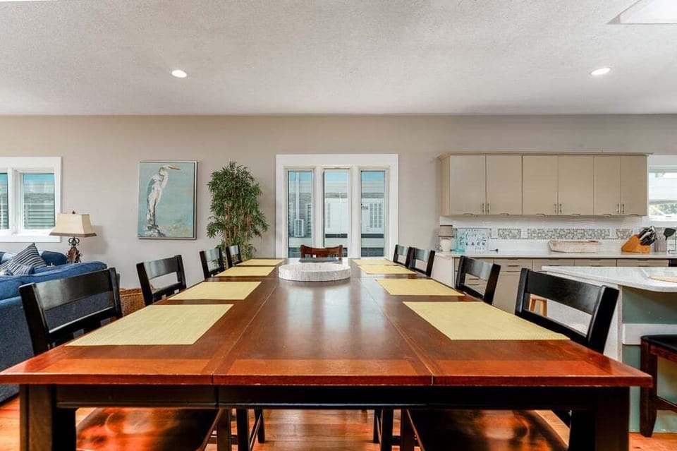 Dining table between kitchen and living room