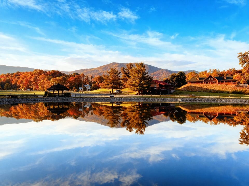 Onsite illuminated fishing pond with mountain views and gazebo.