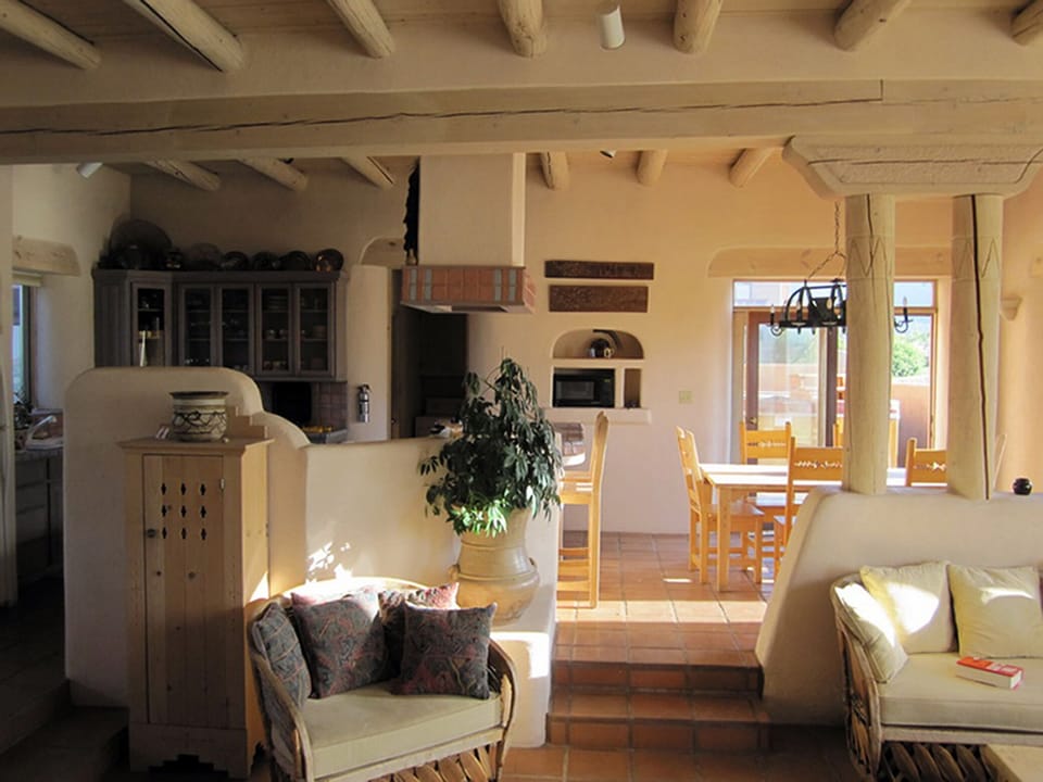 Great Room open to Dining Room and Kitchen.  Back Patio with Outdoor Spa Beyond