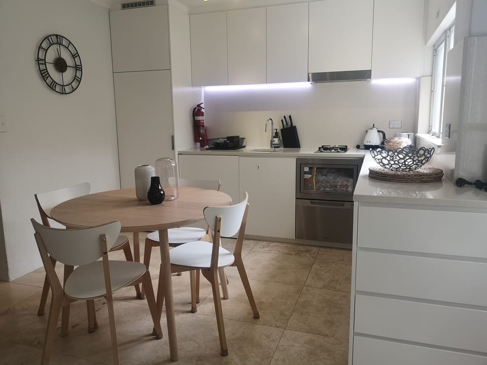 Modern kitchen with fridge, combi microwave, 2 burner gas hob and dishwasher