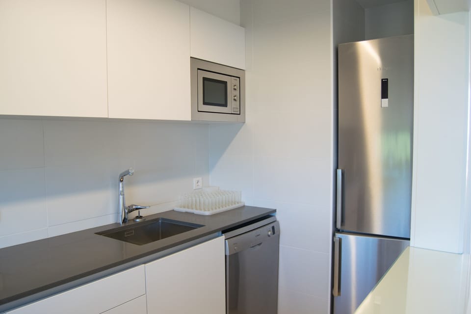 open kitchen with community views-SA PUNTA COSTA BRAVA
