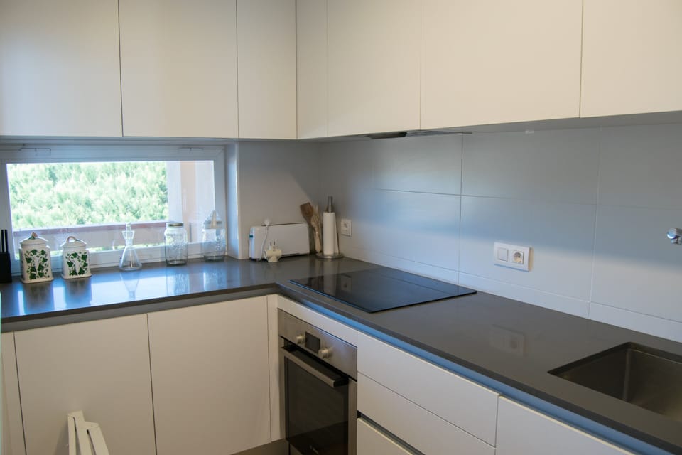 open kitchen with community views-SA PUNTA COSTA BRAVA