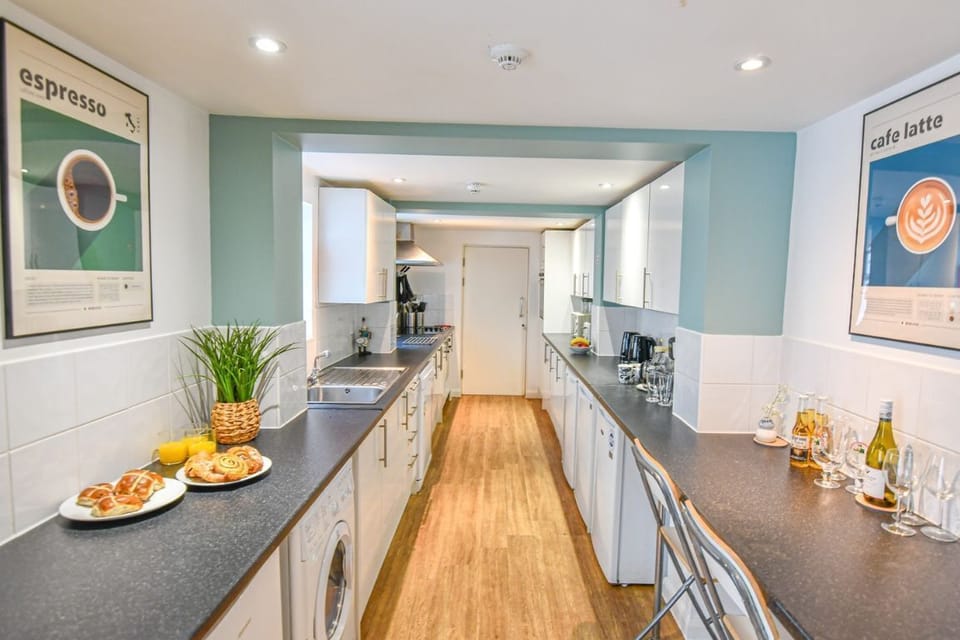 Large self-catering kitchen with two ovens and multiple fridges