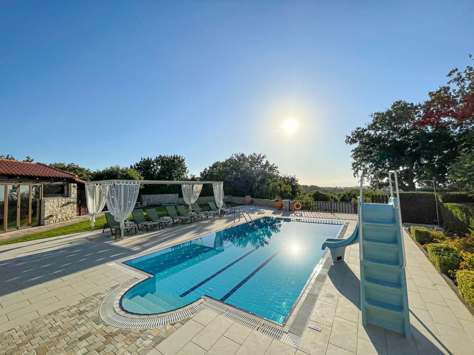 The pool area offering enough space for the whole family and full privacy