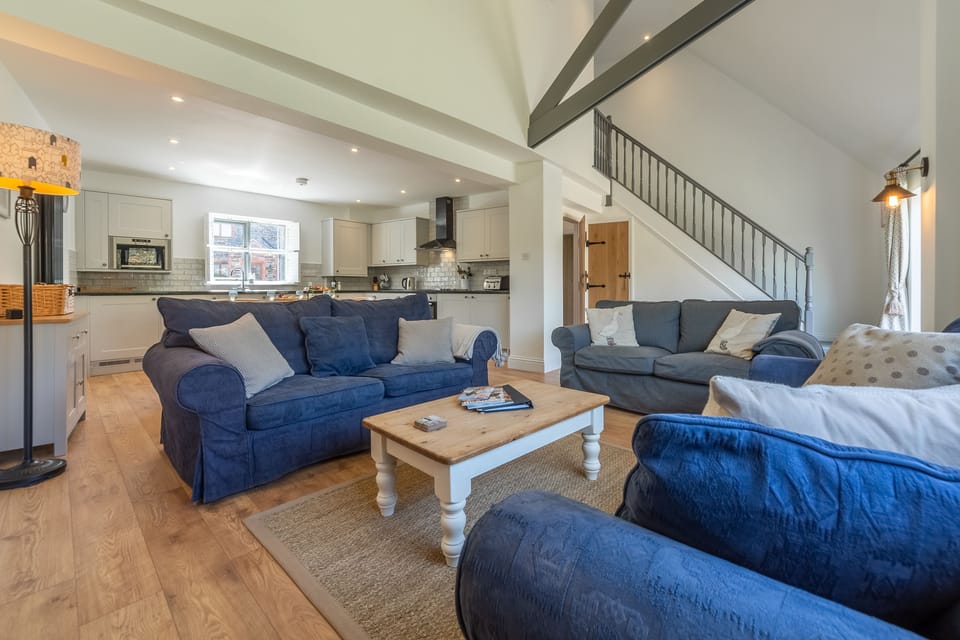 Wedge Cottage, Roserrow. Ground floor: Open-plan sitting room with kitchen beyond
