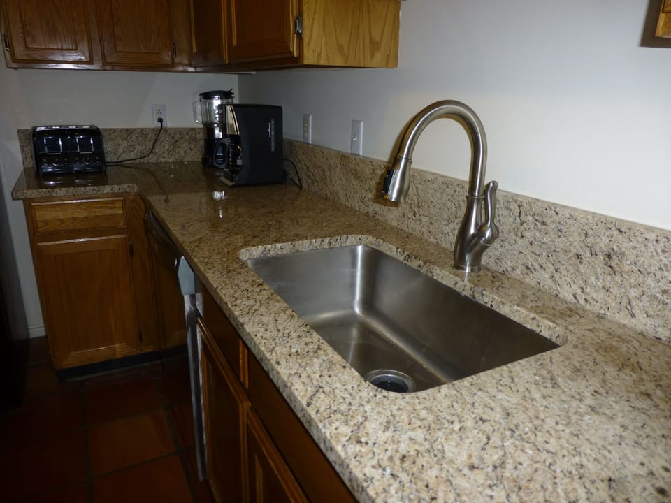 Large stainless sink and granite countertops
