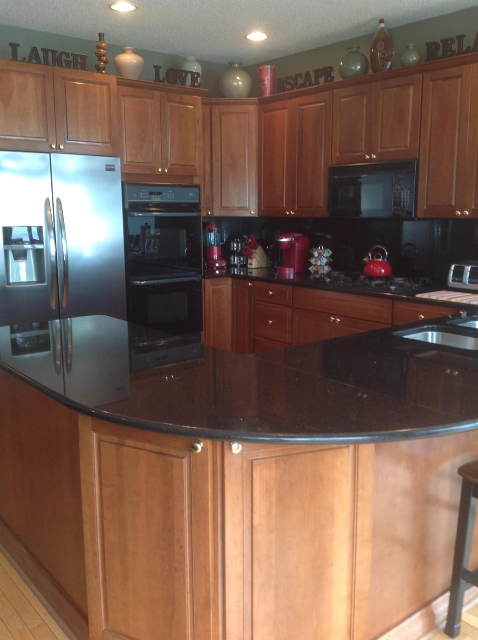Main section of kitchen
Double oven, cook top, refrigerator and dishwasher