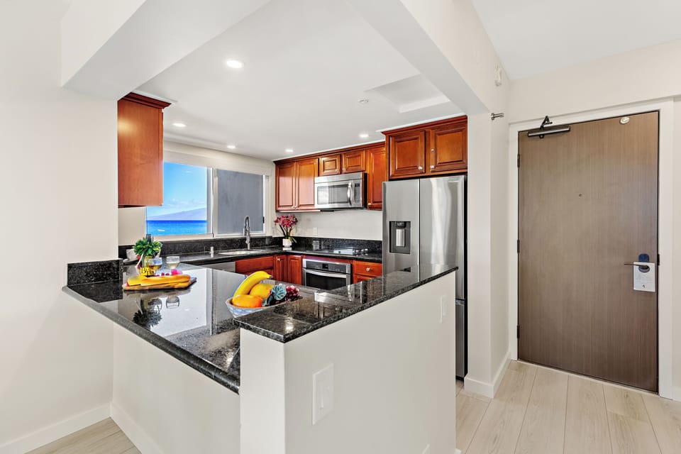 Open kitchen allows easy interaction throughout the condo