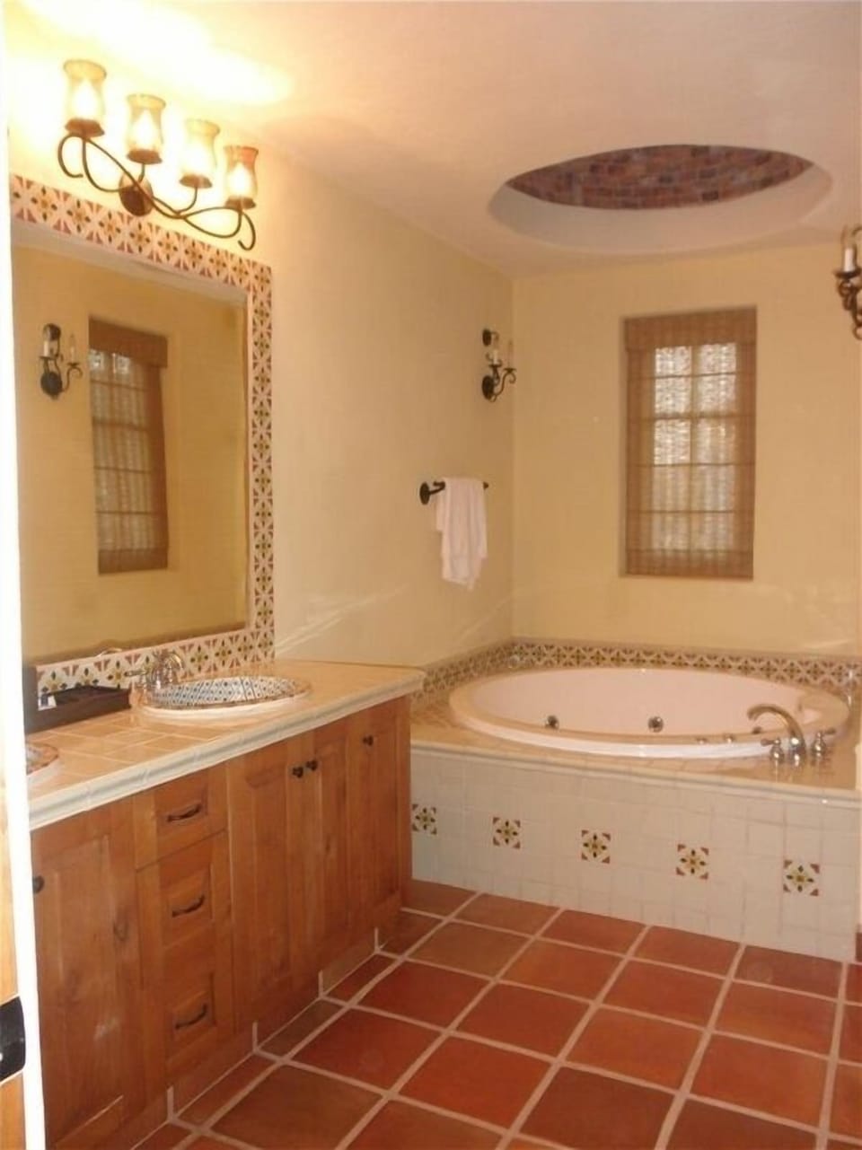Upstairs master bathroom with double sink vanity, soaking tub, shower, & toilet