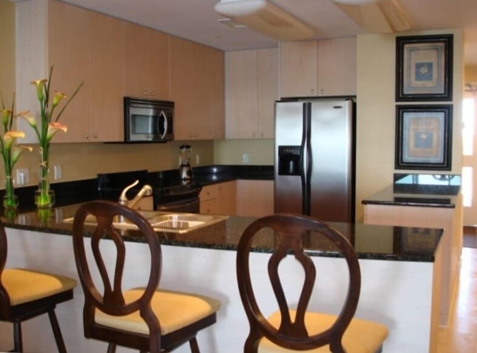 FULLY EQUIPPED KITCHEN: ATTACHED TO OPEN CONCEPT DINNING AND LIVING ROOM