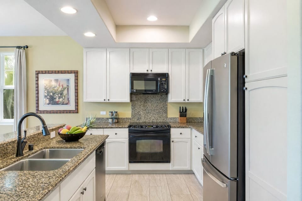 Beautiful open, airy kitchen with island on left