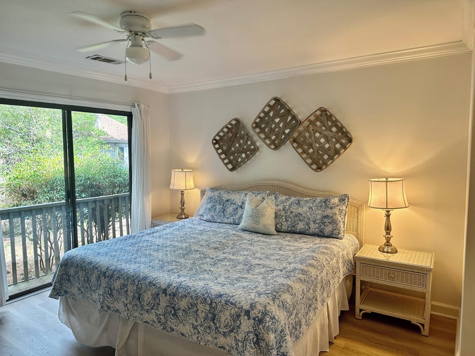 Bright primary bedroom with king bed.