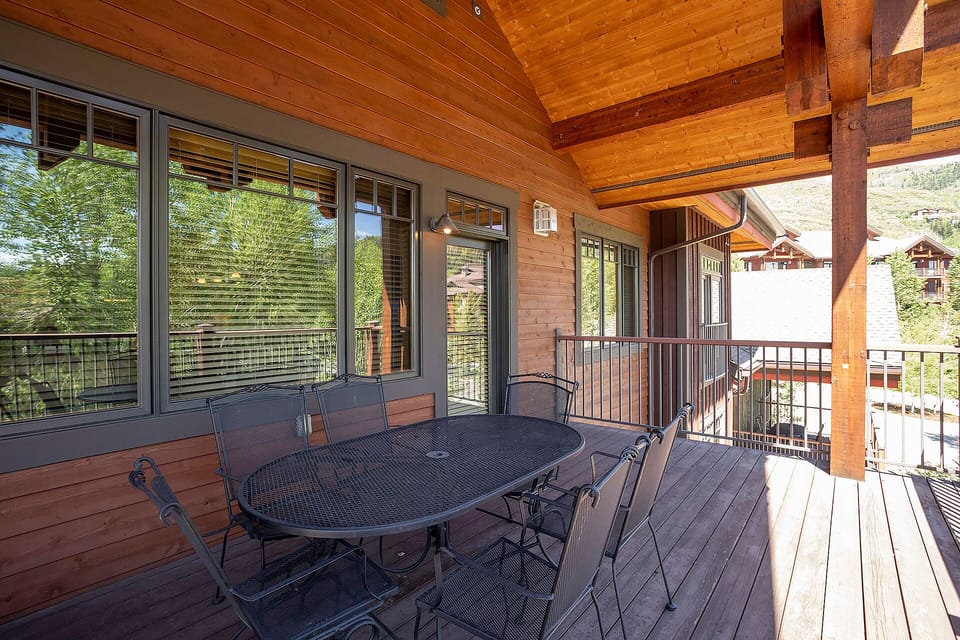 Enjoy morning coffee on your private covered deck with mountain views and outdoor dining for six.
