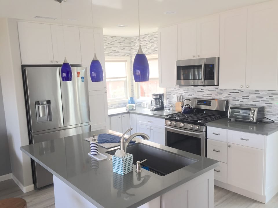 Fully stocked kitchen with dishwasher