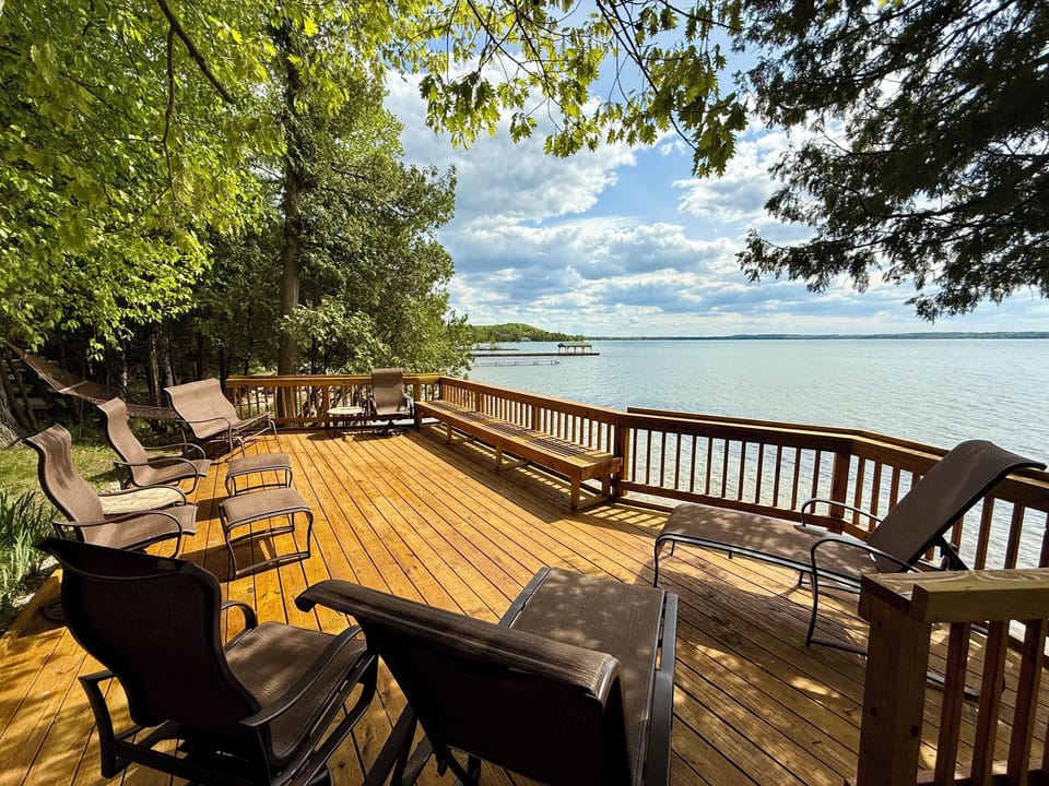 Large lakefront deck — the main gathering space for meals, conversation, and sun