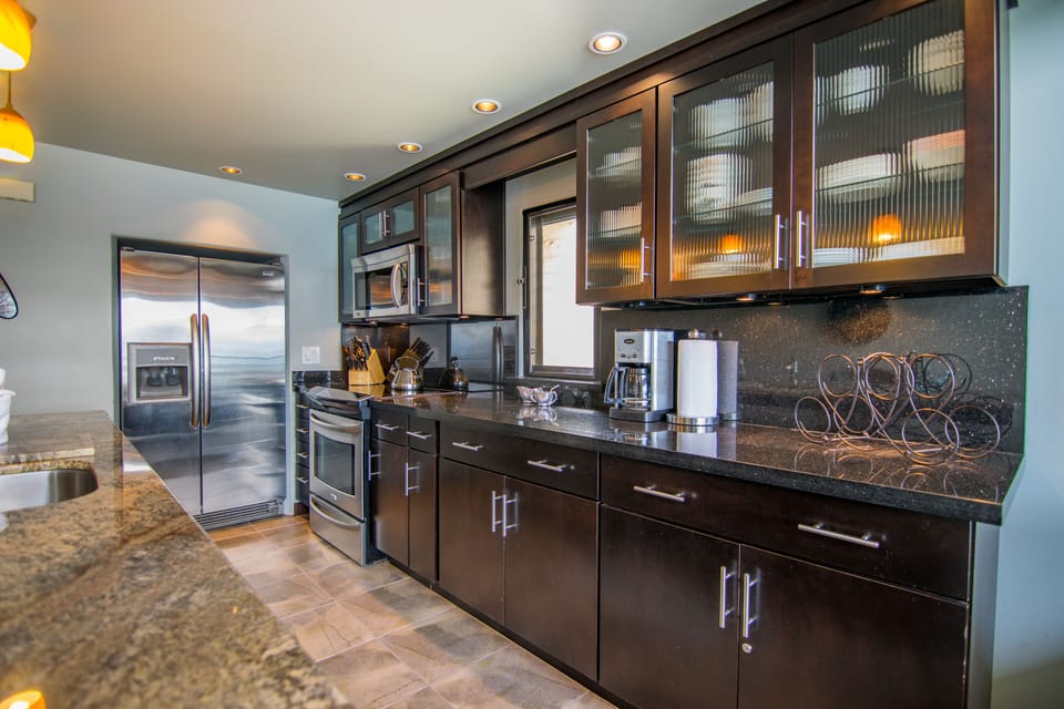 Fully stocked kitchen for preparing gourmet meals and dining in.