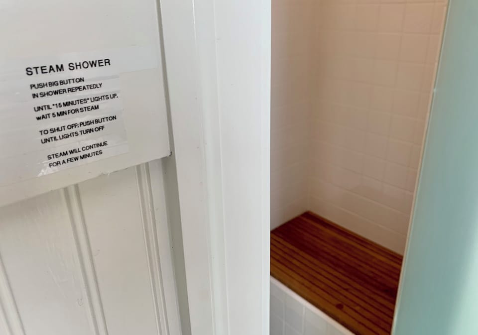 Steam shower with teak seating