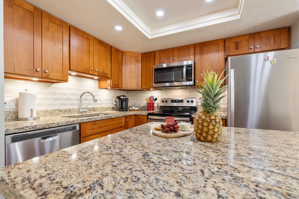 The kitchen has a Keurig coffee maker, kettle, toaster and blender. 