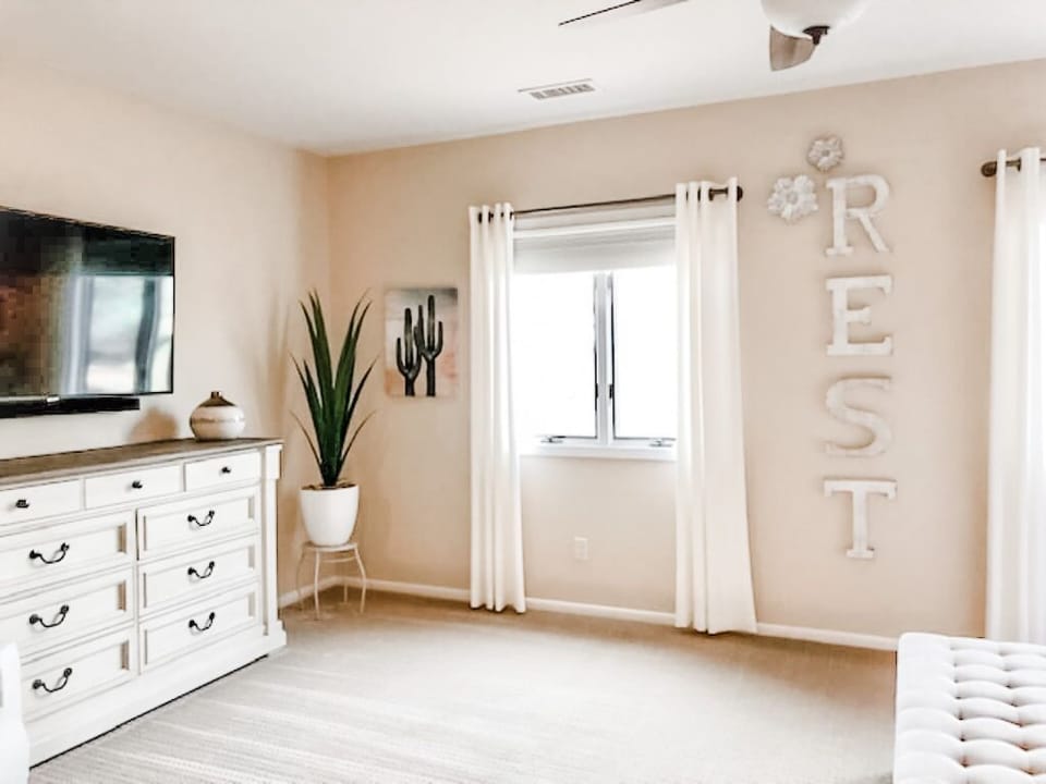 Large master bedroom complete with sitting area and 55 inch TV. 