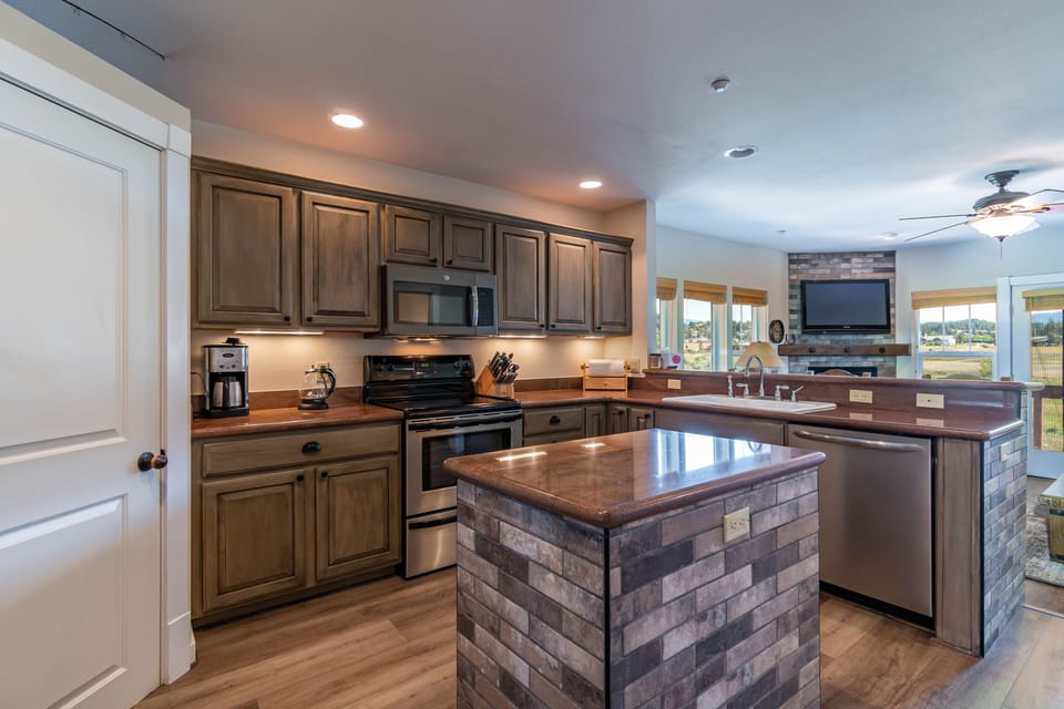 New microwave,dishwasher and brick accent.Open to the great room and river deck