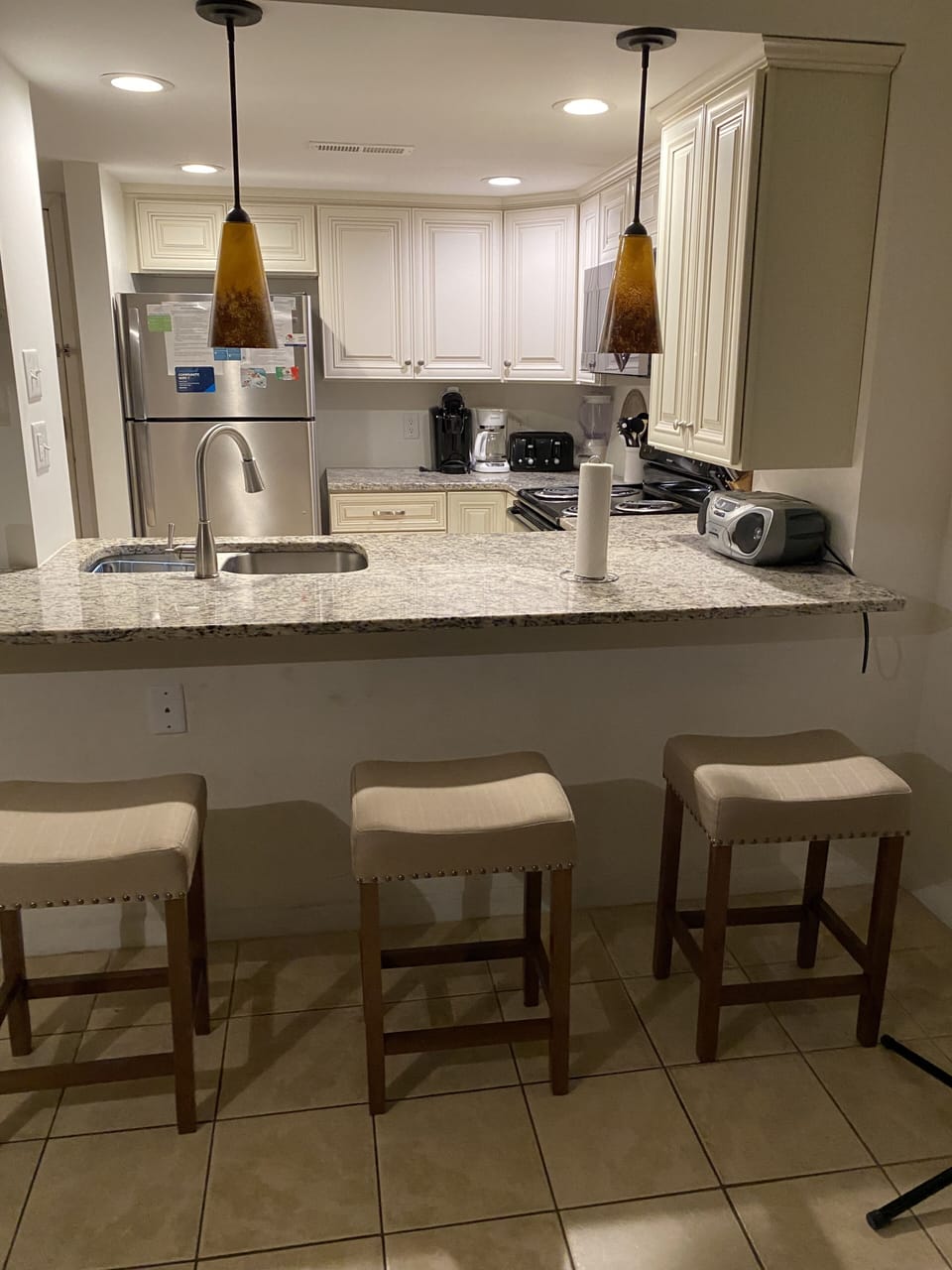 Kitchen counter seating for three. 
