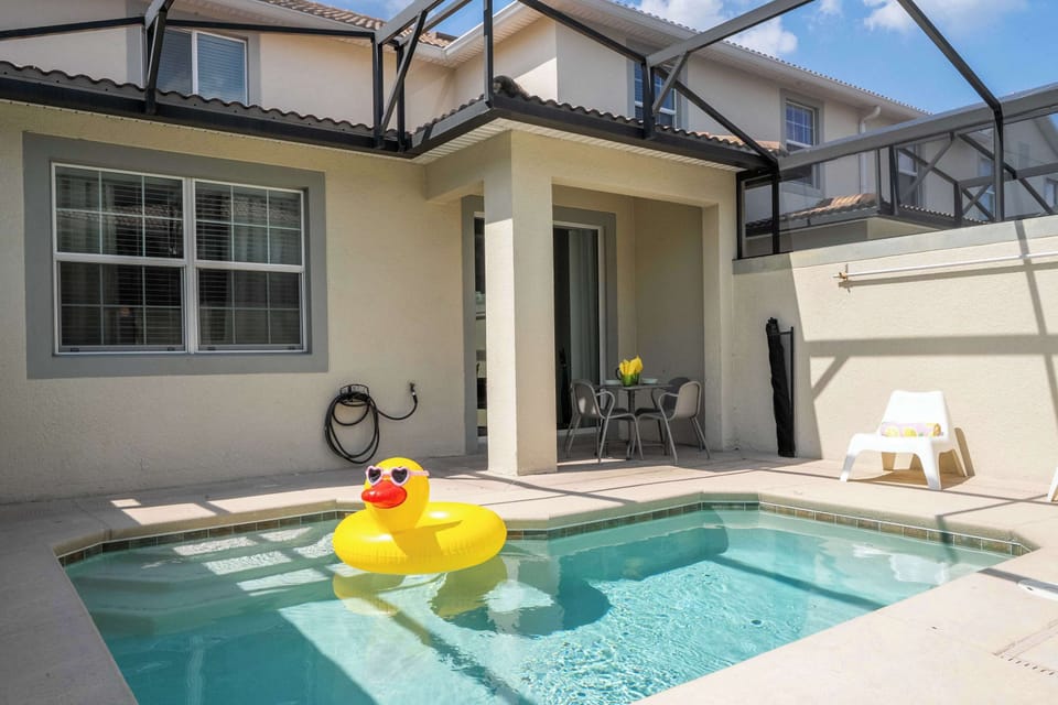 Unwind in style by your private pool, featuring comfy seating, a cheerful floatie, and plenty of space for sunshine and fun with friends or family.