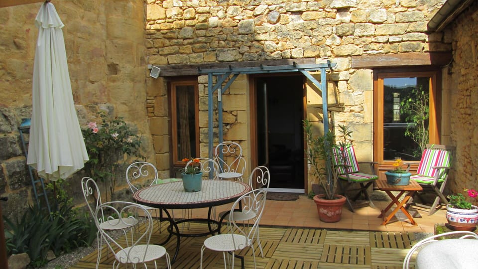 View of private back courtyard garden and terrace