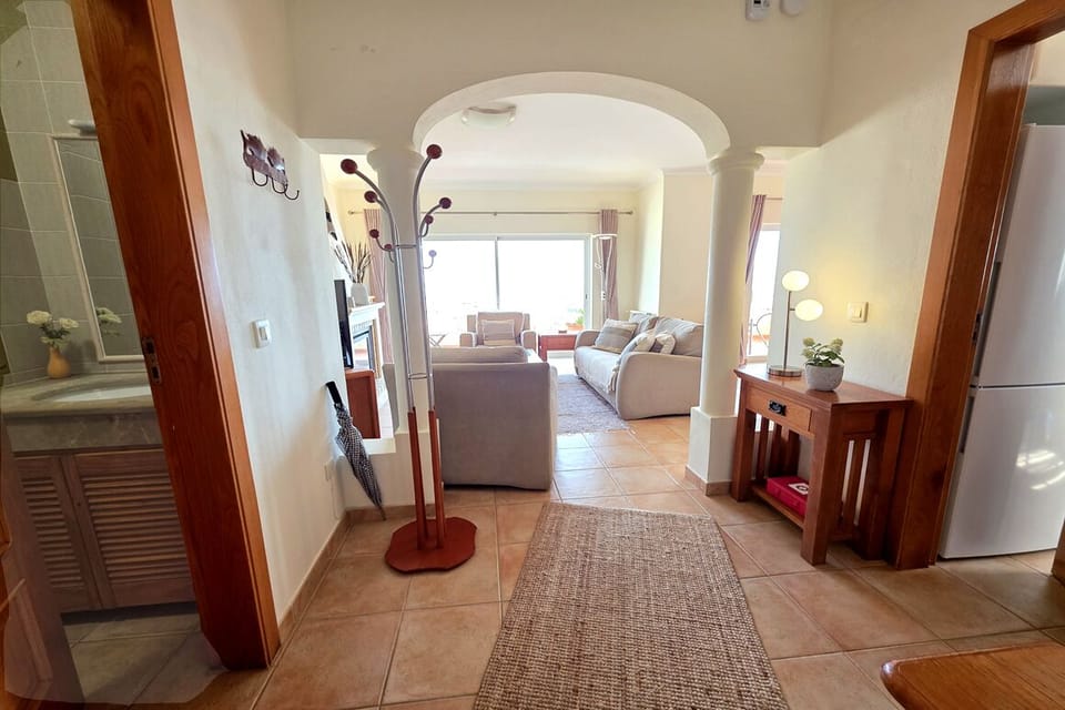 Entrance Hall with WC on Left, Kitchen on Right, Livingroom in Front