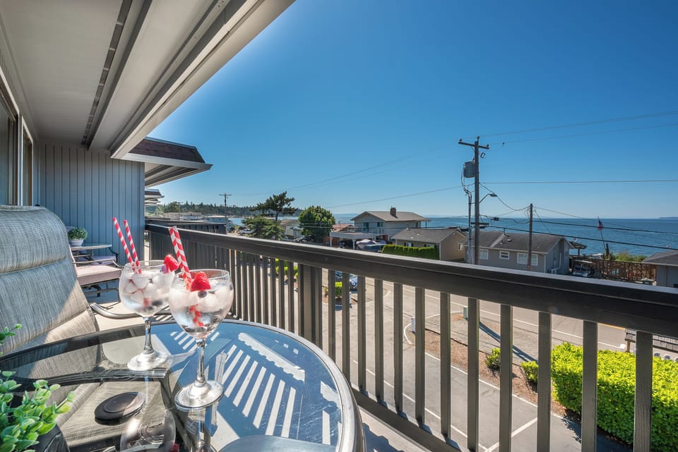 Sip your drinks while watching the sunset over the bay