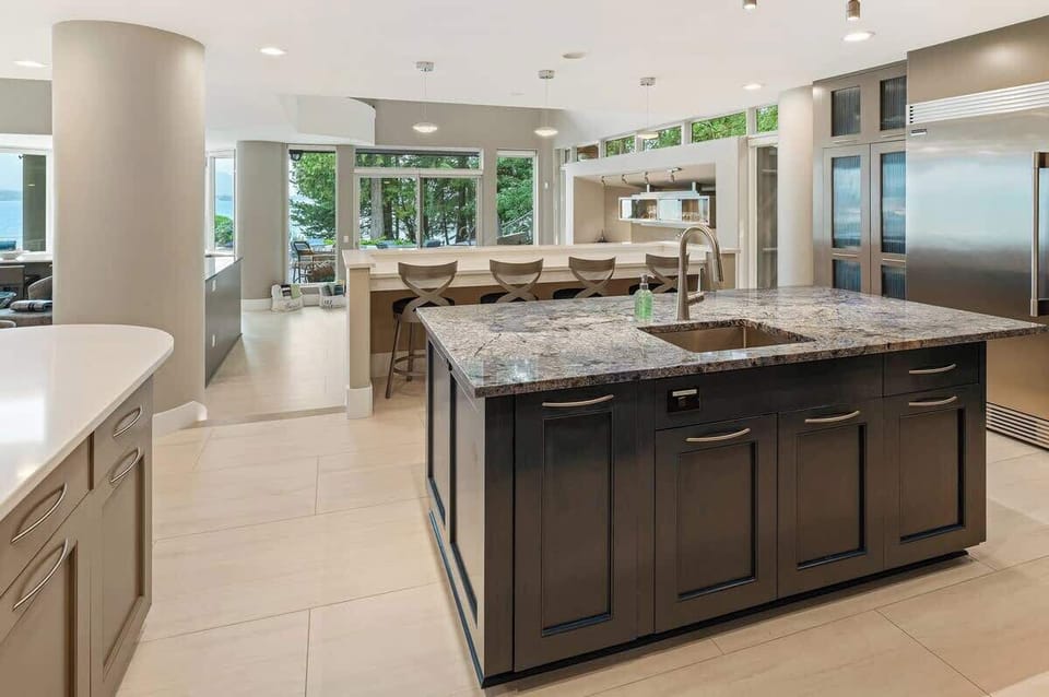 Breakfast bar overlooks dining table below.