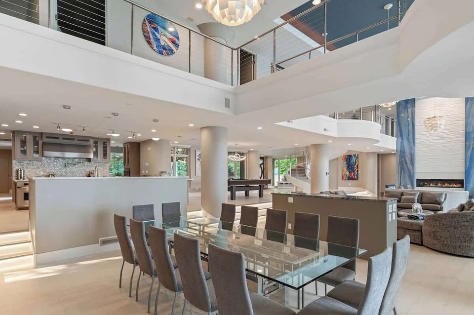 Dining room showcasing a stunning 14-person table, designed for hosting grand gatherings or intimate family meals in style.