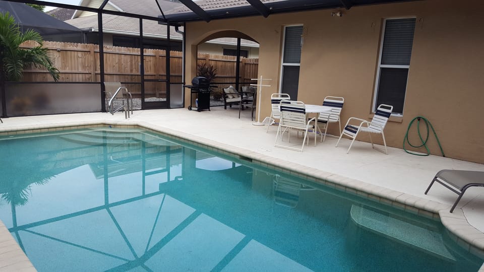 outside table and chairs, propane tank grill