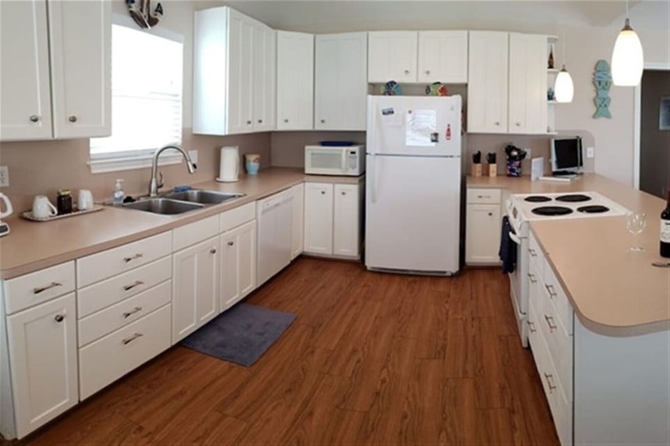 Second view of the open kitchen and prep space