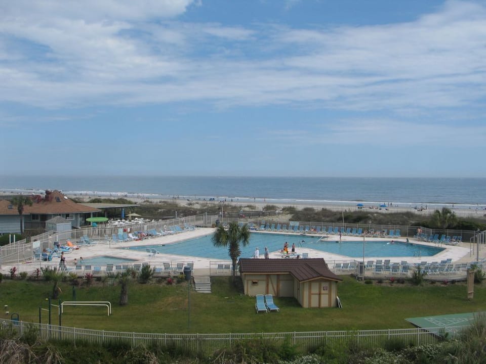 Main pool at the resort with shaded area 