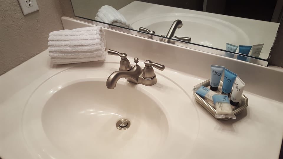 Start up toiletries, sparkling white sinks.