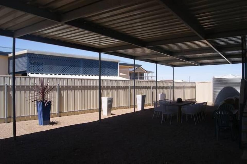 Veranda - perfect for entertaining. Room for a car here too.