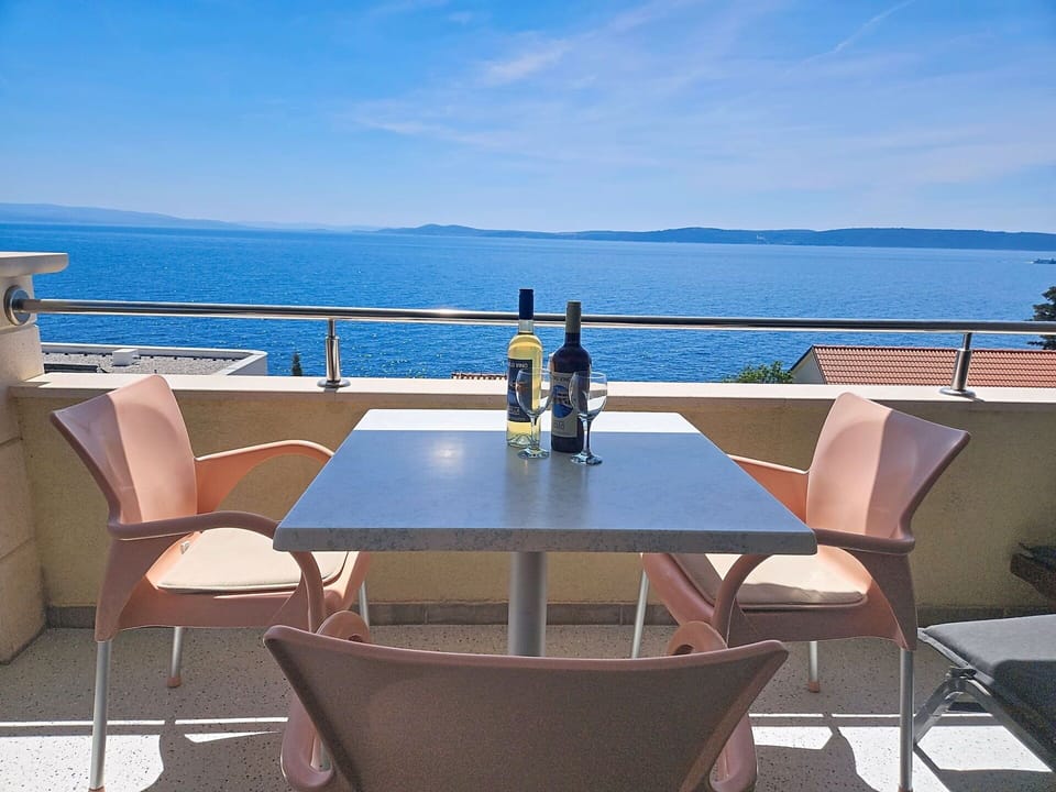 Furniture, Chair, Outdoor Furniture, Wood Stain, Outdoor Table, Balcony, Restaurant, Kitchen & Dining Room Table, Hotel