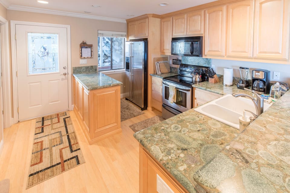 Large, beautiful kitchen on middle level.
