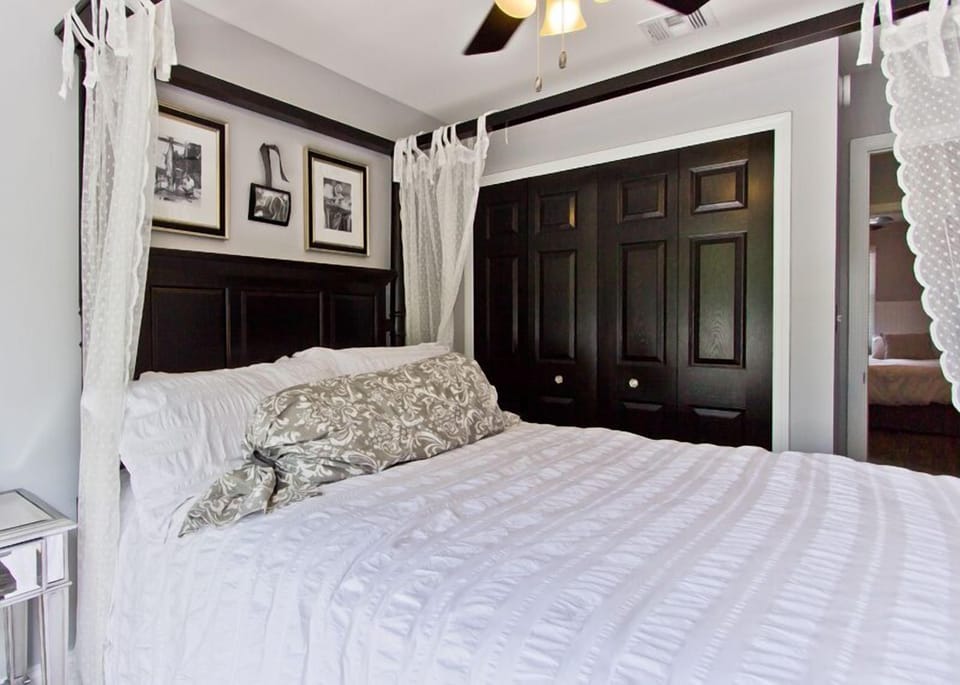 custom closet organizers in both bedrooms offer plenty of space in both rooms