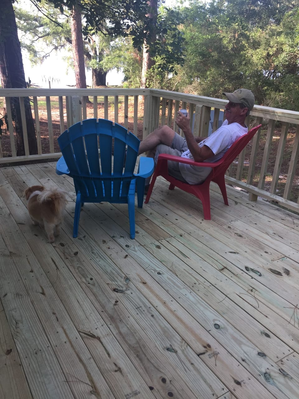 Mark enjoys the deck on the kitchen side of the house! With a charcoal grill.